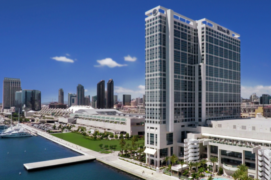 Hilton San Diego Bayfront hotel with city skyline and marina, offering stunning views of San Diego Bay and vibrant city life.